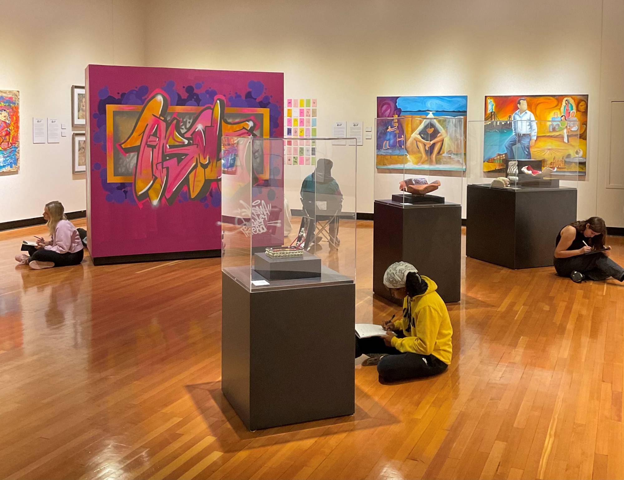 GVSU students doing a writing activity in the Art Gallery